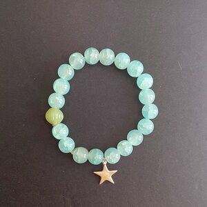 Catch a falling star handcrafted stretch bracelet with sterling star charm.